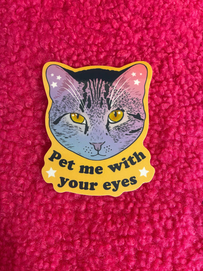 Sticker of a cat with 'Pet me with your eyes' text on a pink textured background