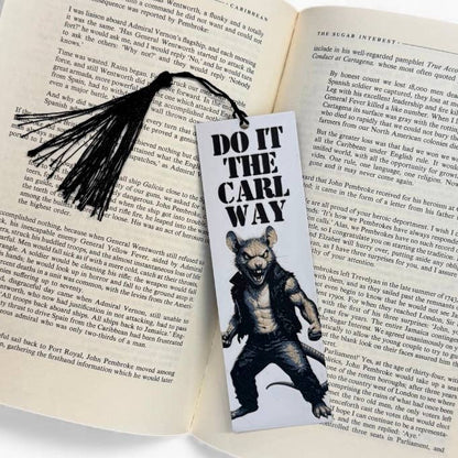 Bookmark with a bear graphic and text on an open book