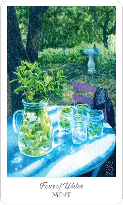 Card from a tarot deck showing a table with mint leaves and water, set against a garden background.