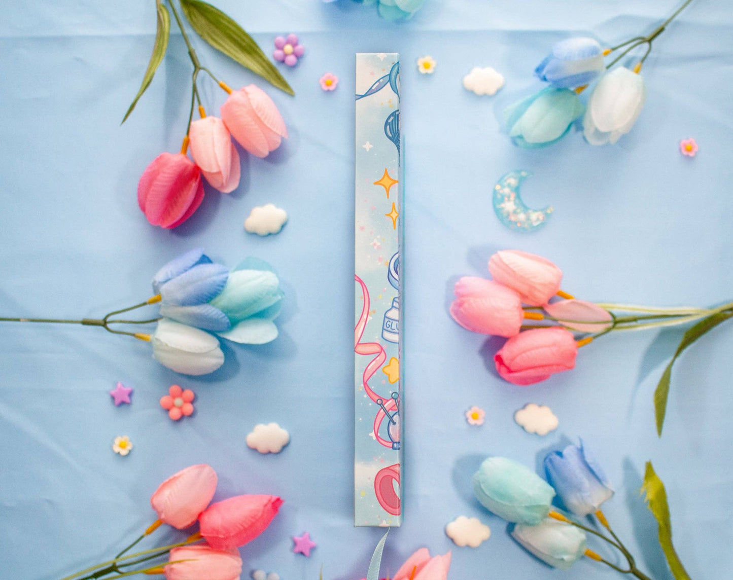 Colorful tulips on a blue background with decorative elements