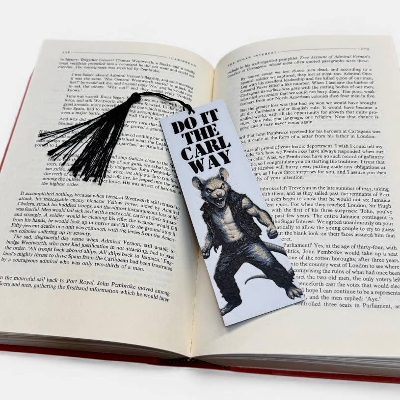 Open book with a bookmark featuring a character and text 'Do It The Carl Way' on a white background.