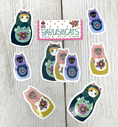 Set of Babushcats stickers on a wooden surface