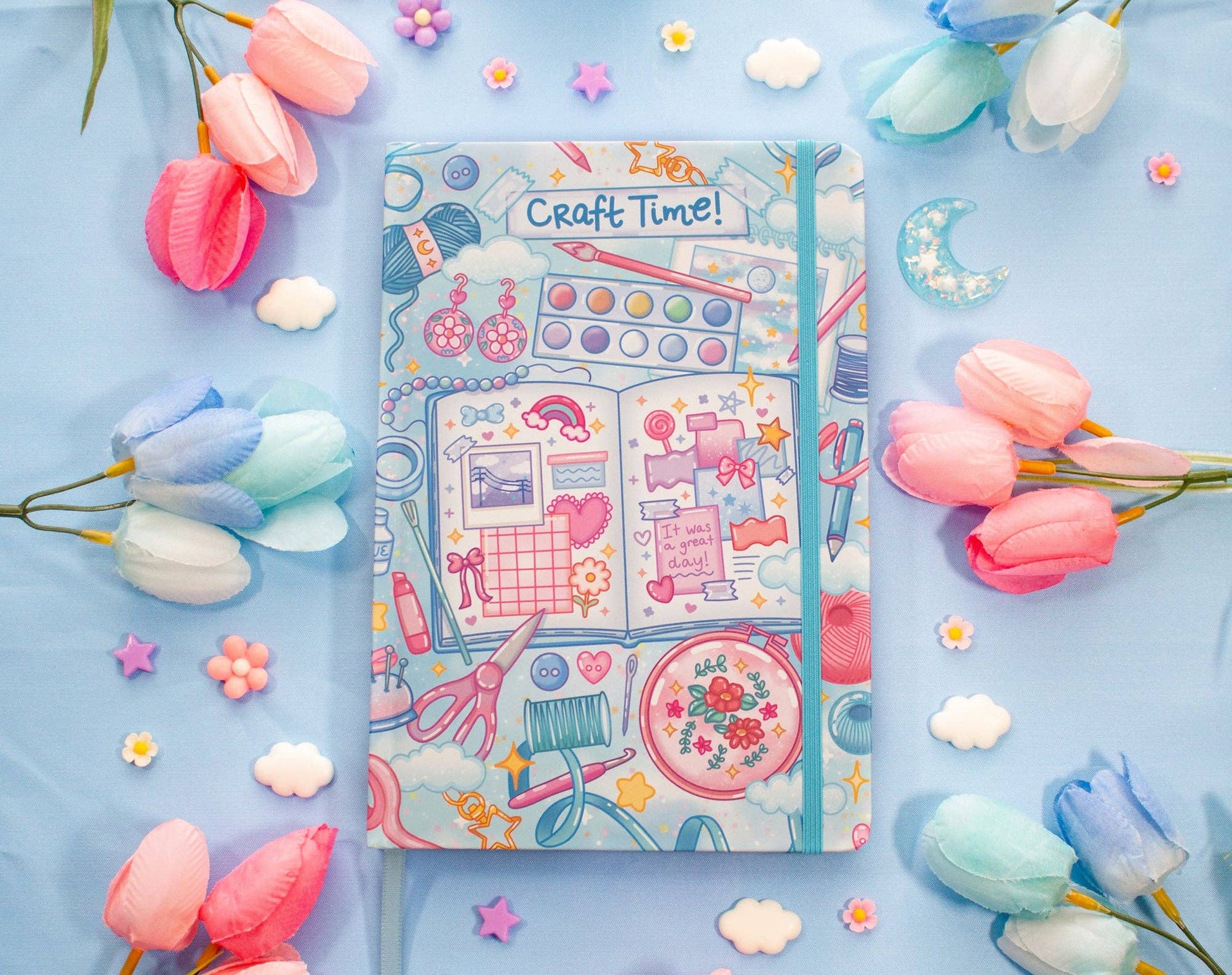 Decorative notebook titled 'Craft Time!' surrounded by flowers on a blue background
