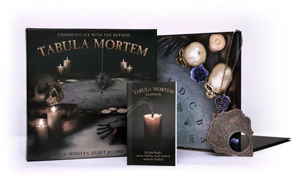 Tabula Mortem product set with packaging, guidebook, and decorative elements on a white background