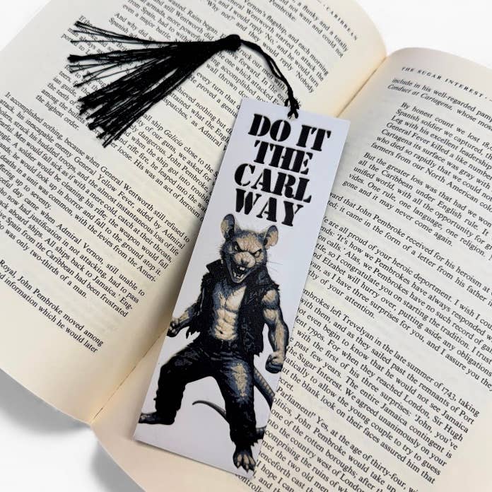 Book with a bookmark featuring a wolf-like creature and text 'Do it the Carl Way' on an open book.