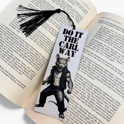 Book with a bookmark featuring a wolf-like creature and text 'Do it the Carl Way' on an open book.