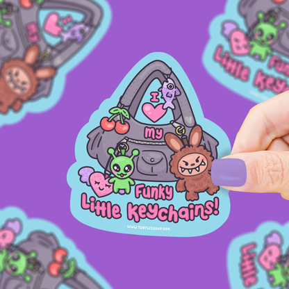 Sticker with cartoon keychains on a purple background