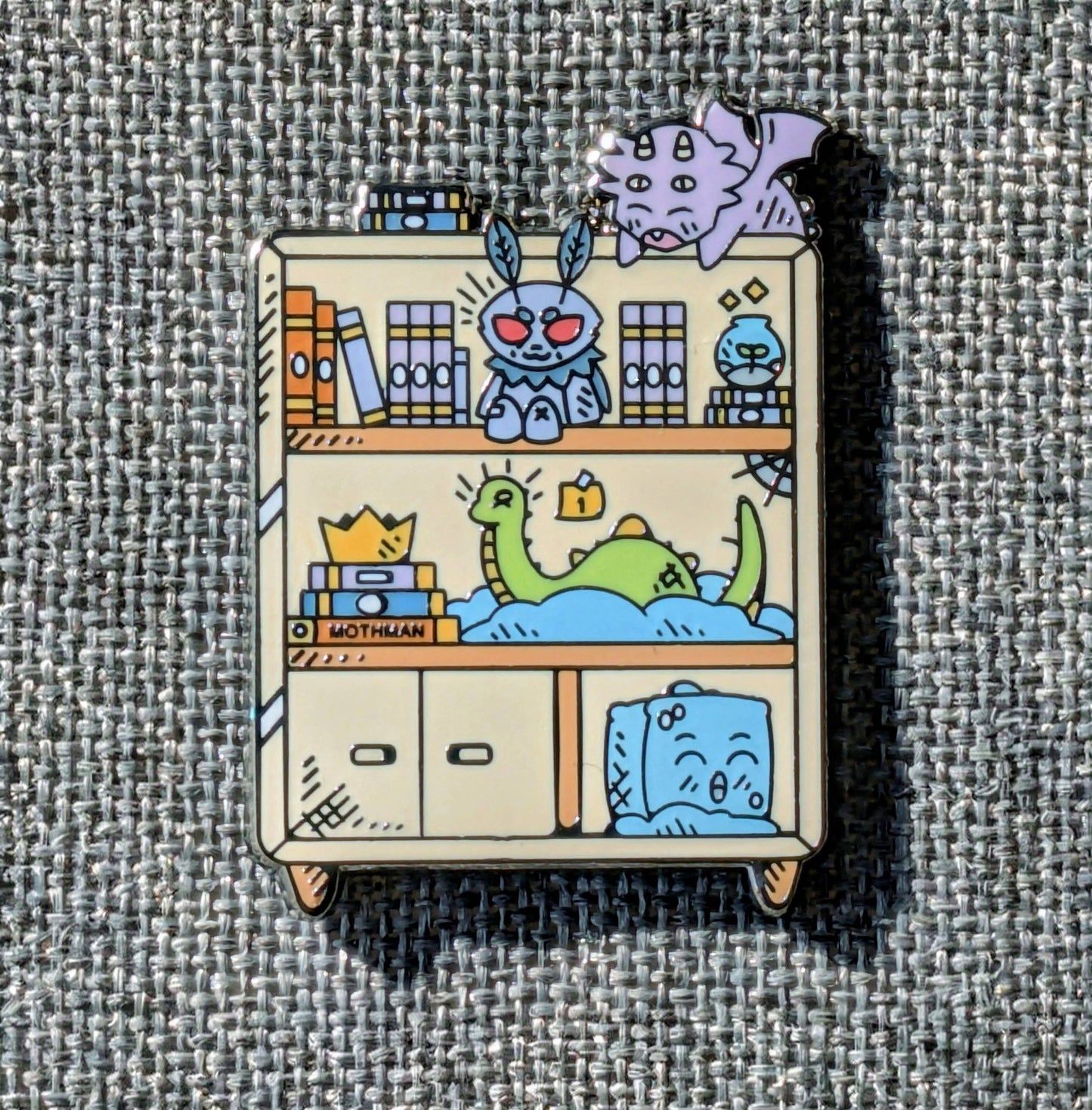 Cryptid Bookshelf Enamel Pin - 1.5"